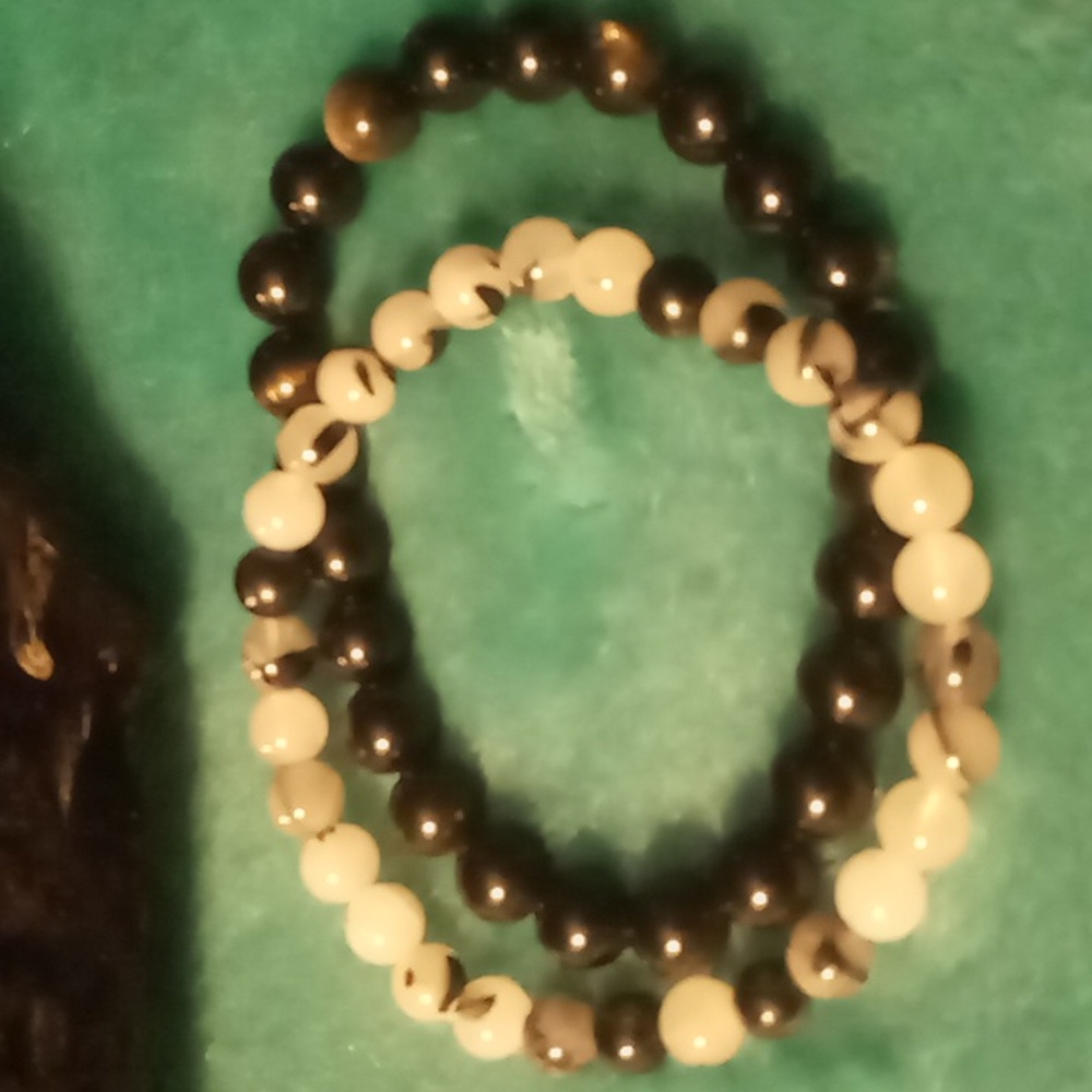 2 expandable glass beaded black ,white, clear glass beaded